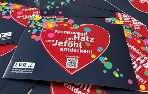 Grafik mit QR Code und Herzmotiv, auf dem steht: "Fastelovend mit Hätz und Jeföhl entdecken"