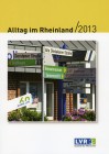 Cover Alltag im Rheinland: ein Wegweiser mit zahlreichen Schildern, die in unterschiedlichste Richtungen zeigen.